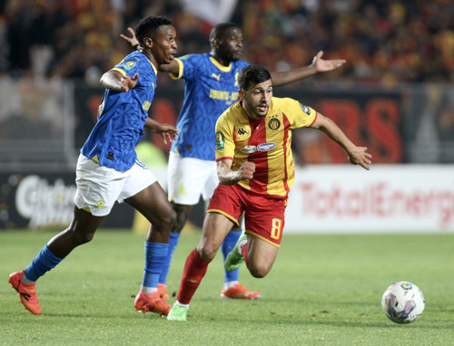 Houssem Tka of Esperance Tunis challenged by Themba Zwane of Mamelodi Sundowns during the CAF Champions League 2023/24 1st leg semifinal match between Esperance Tunis and Mamelodi Sundowns at Stade Olympique Hammadi Agrebi in Rades, Tunisia on 20 April 2024