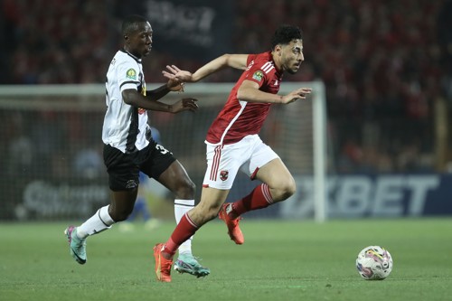 Akram Tawfik of Al Ahly challenged by Glody Likonza of TP Mazembe during the CAF Champions League 2023/24 semifinals match between Al Ahly and TP Mazembe held at Cairo International Stadium in Cairo, Egypt on 25 April 2024