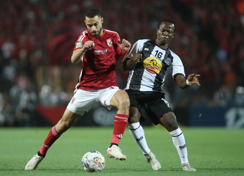 Amr El Solia of Al Ahly challenged by Oscar Kabwit of TP Mazembe during the CAF Champions League 2023/24 semifinals match between Al Ahly and TP Mazembe held at Cairo International Stadium in Cairo, Egypt on 25 April 2024