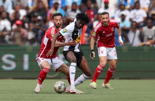 Ibrahima Keita of TP Mazembe challenged by Ahmed Abdel Kader of Al Ahly during the CAF Champions League 2023/24 1st leg semifinal match between TP Mazembe and Al Ahly at Stade TP Mazembe in Lubumbashi, DRC on 20 April 2024